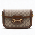 Gucci 1955 Horsebit Shoulder Bag, GG Supreme canvas with brown leather trim, front view with gold horsebit