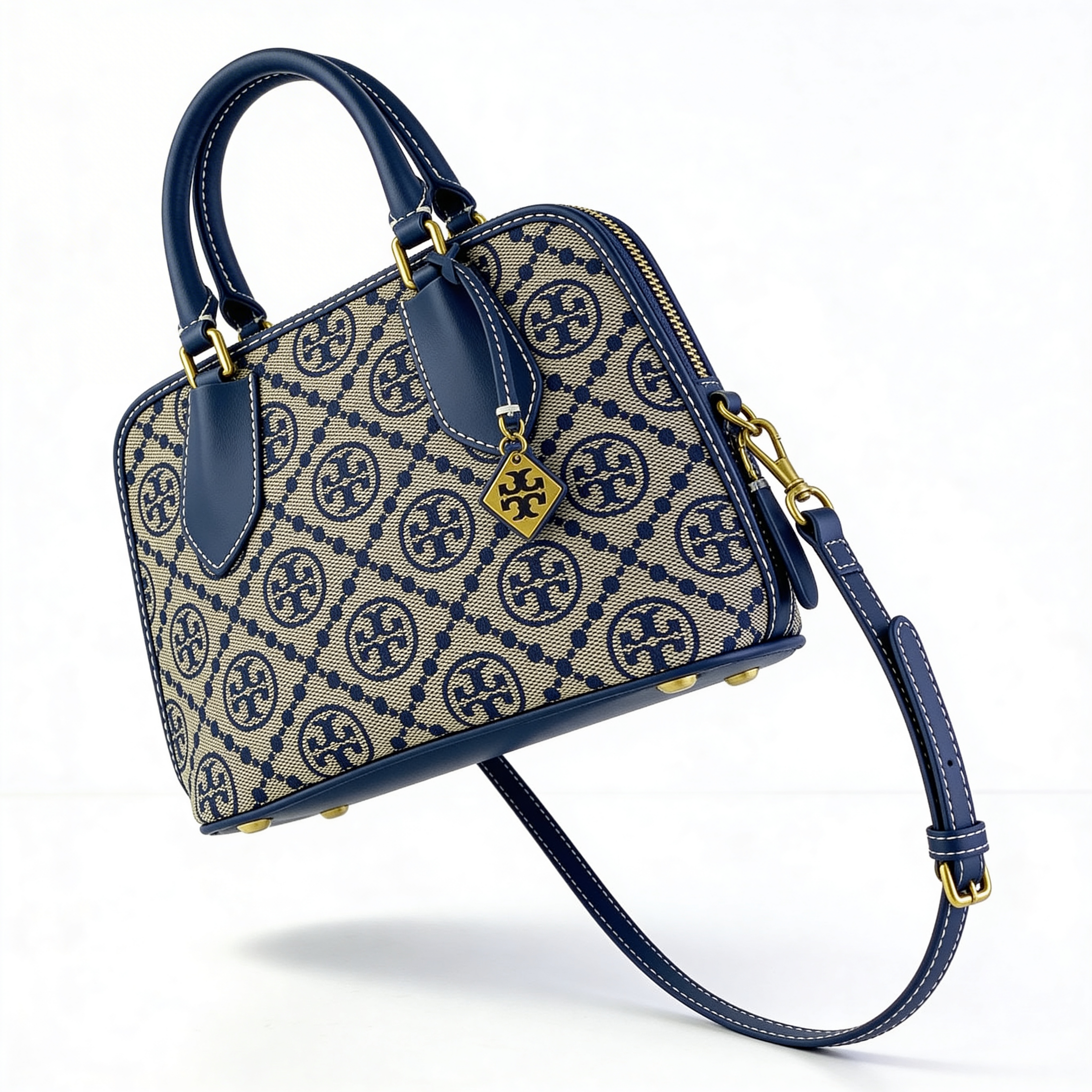 Tory Burch T-Monogram Mini Satchel, detail of T-Monogram pattern and gold T charm