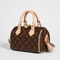 Louis Vuitton Speedy, Monogram canvas, three-quarter front view with vachetta handles and brass padlock