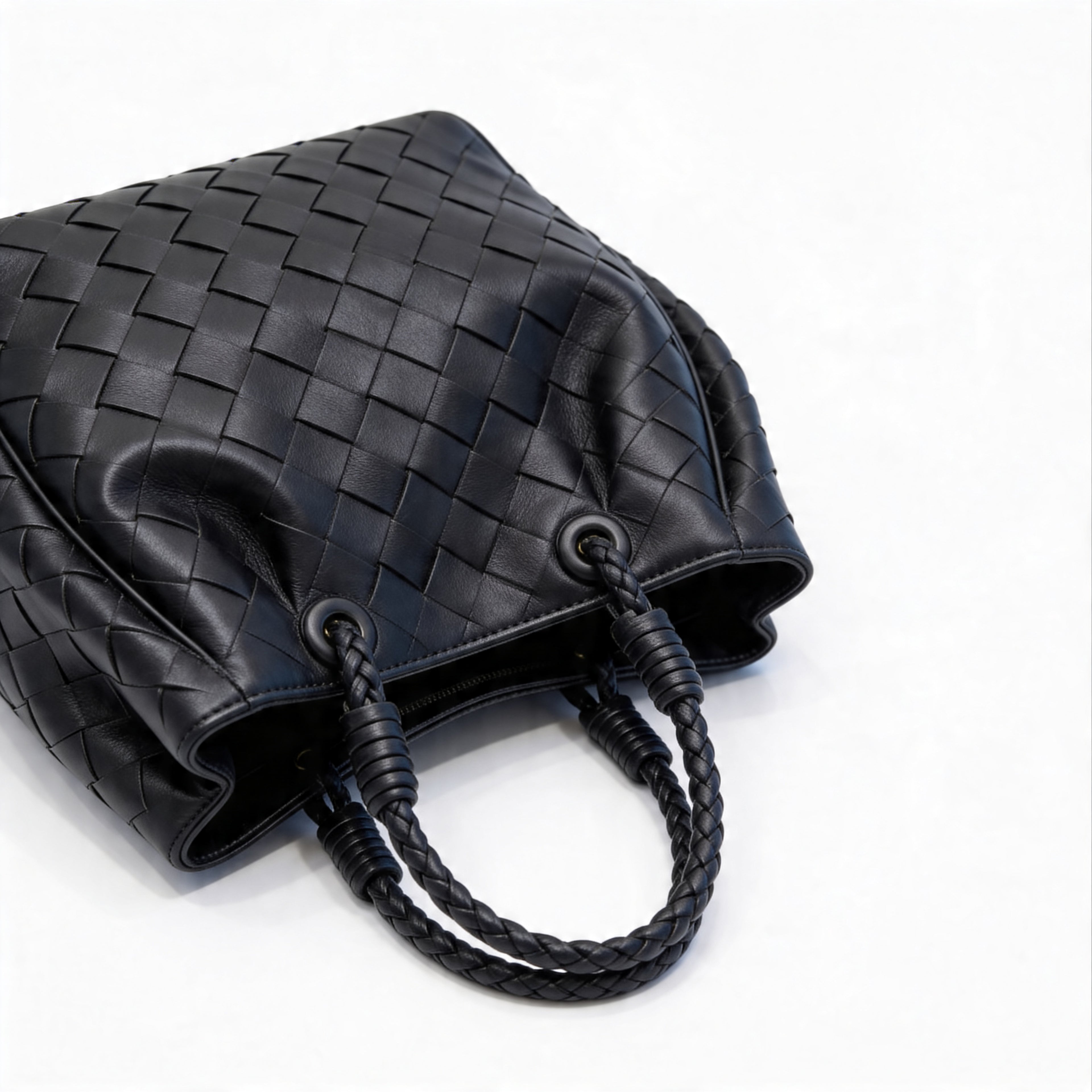 Bottega Veneta Andiamo Mini Tote, top-down view of black intrecciato weave with braided handles