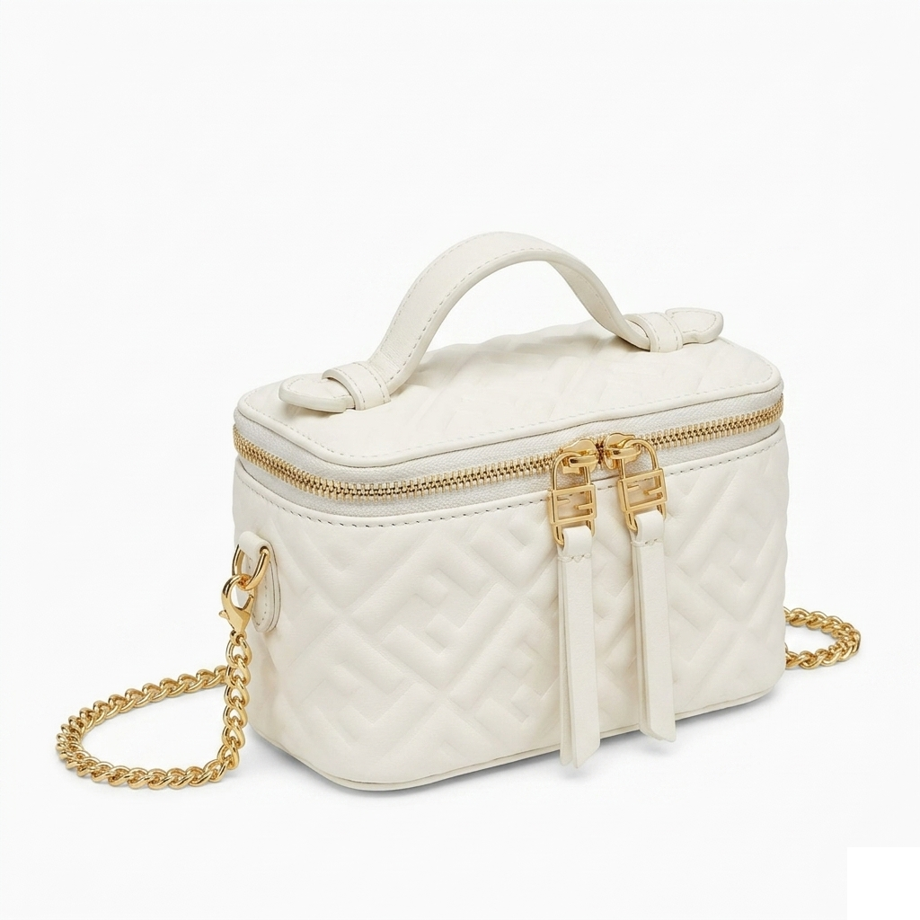Fendi Mini Vanity Case, close-up 3/4 angle showing FF embossed quilted leather pattern and gold double-slider zip pulls