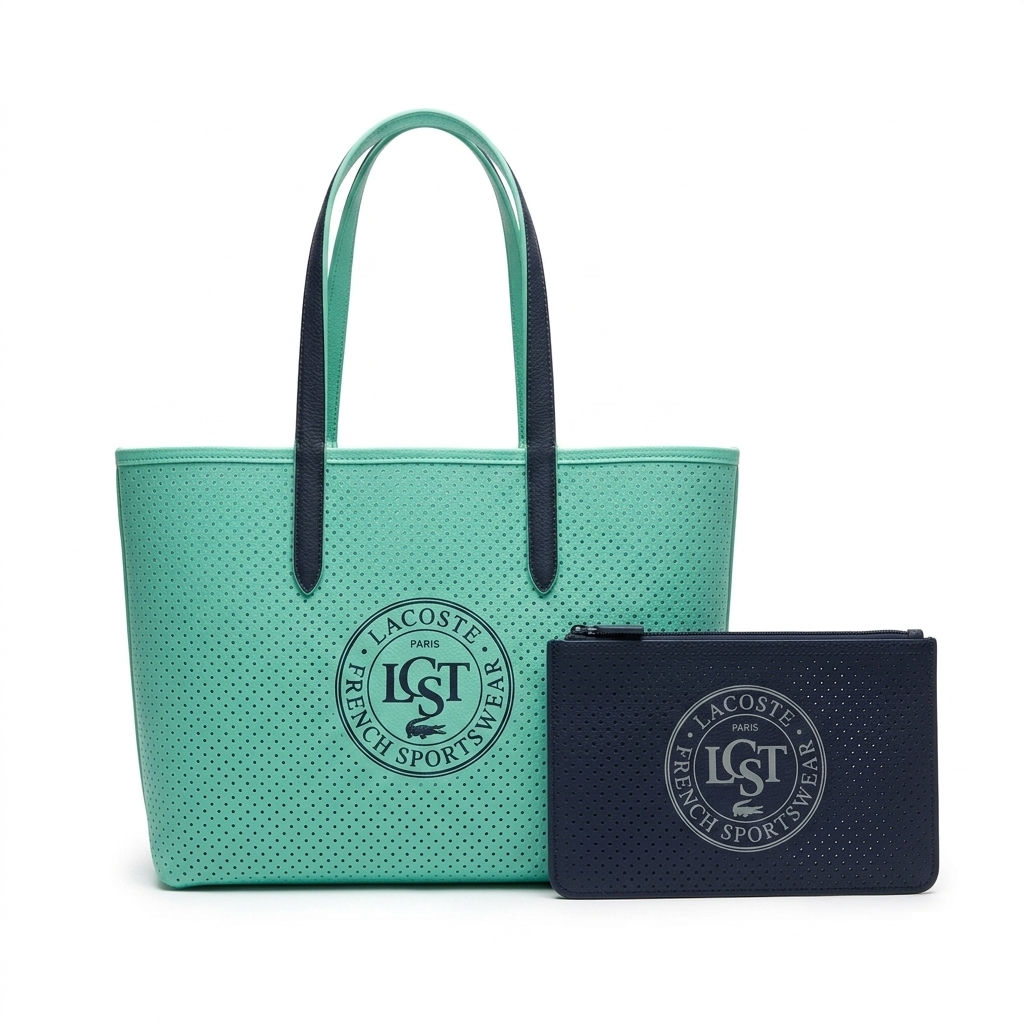 Lacoste Anna Perforated Tote, mint coated canvas with navy LCST circle stamp and matching navy pouch, front view on pure-white